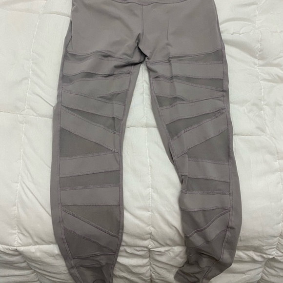Lululemon tights with mesh cut outs. Size 10. Used - Picture 2 of 5
